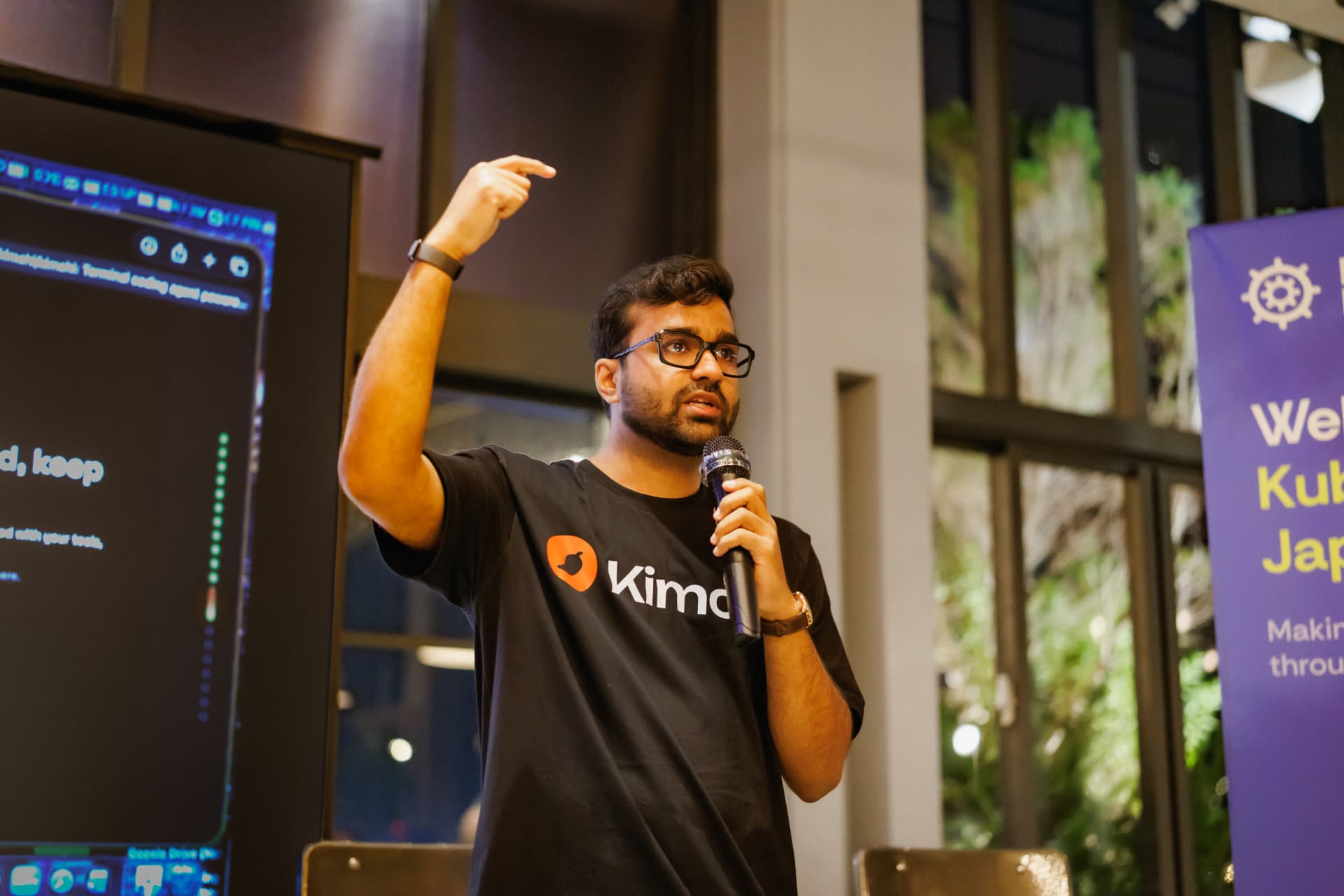 Kimchi speaker presenting the coding agent demo