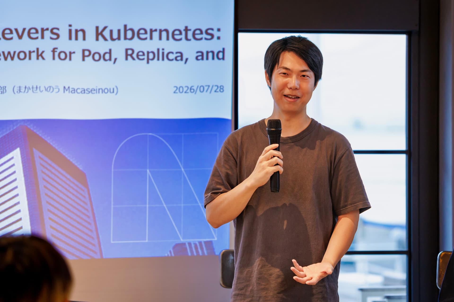 Speaker presenting on scaling levers in Kubernetes