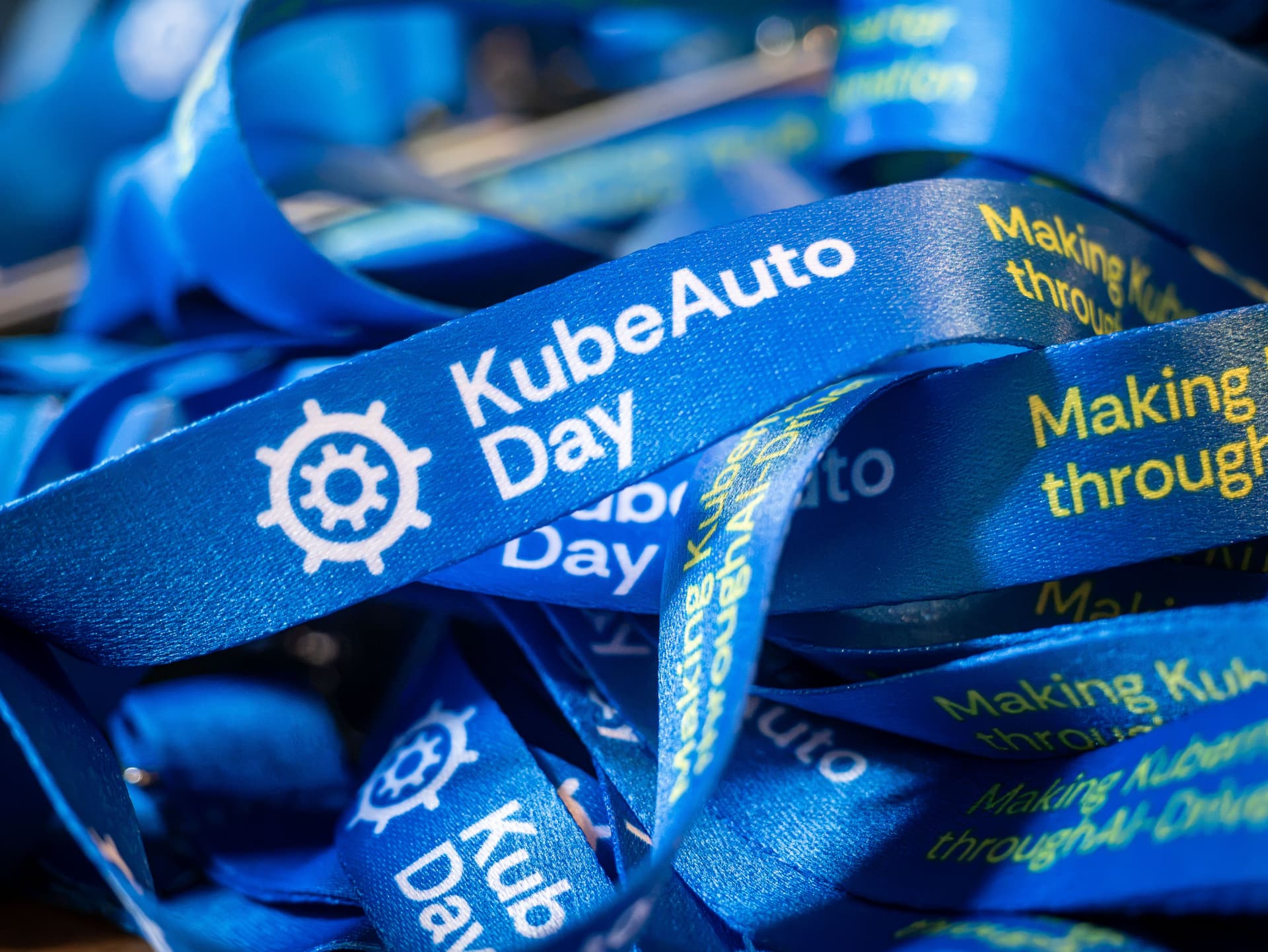 Close-up of blue KubeAuto Day lanyards
