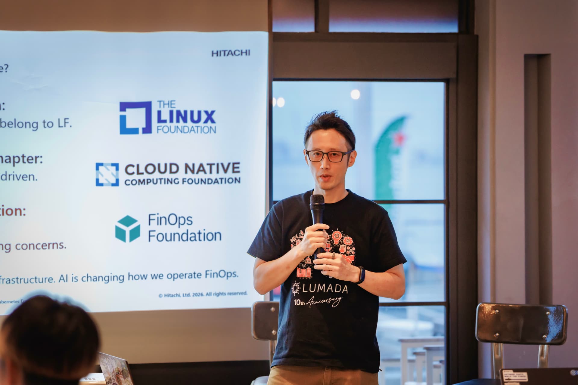 Hitachi speaker presenting on FinOps and cloud native